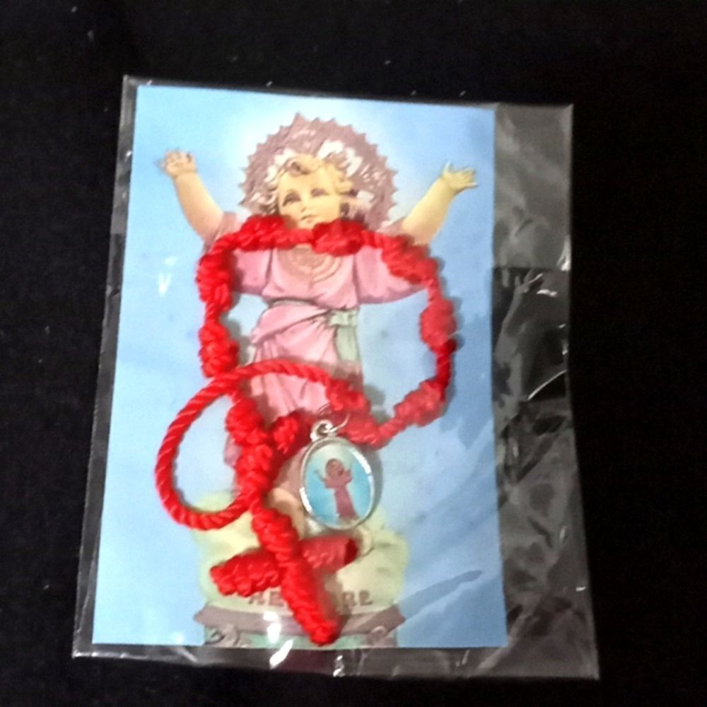 Red pull string w cross and baby Jesus pendant bracelet